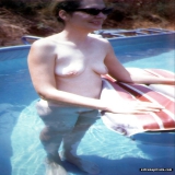 Nudist amateurs in and around the pool